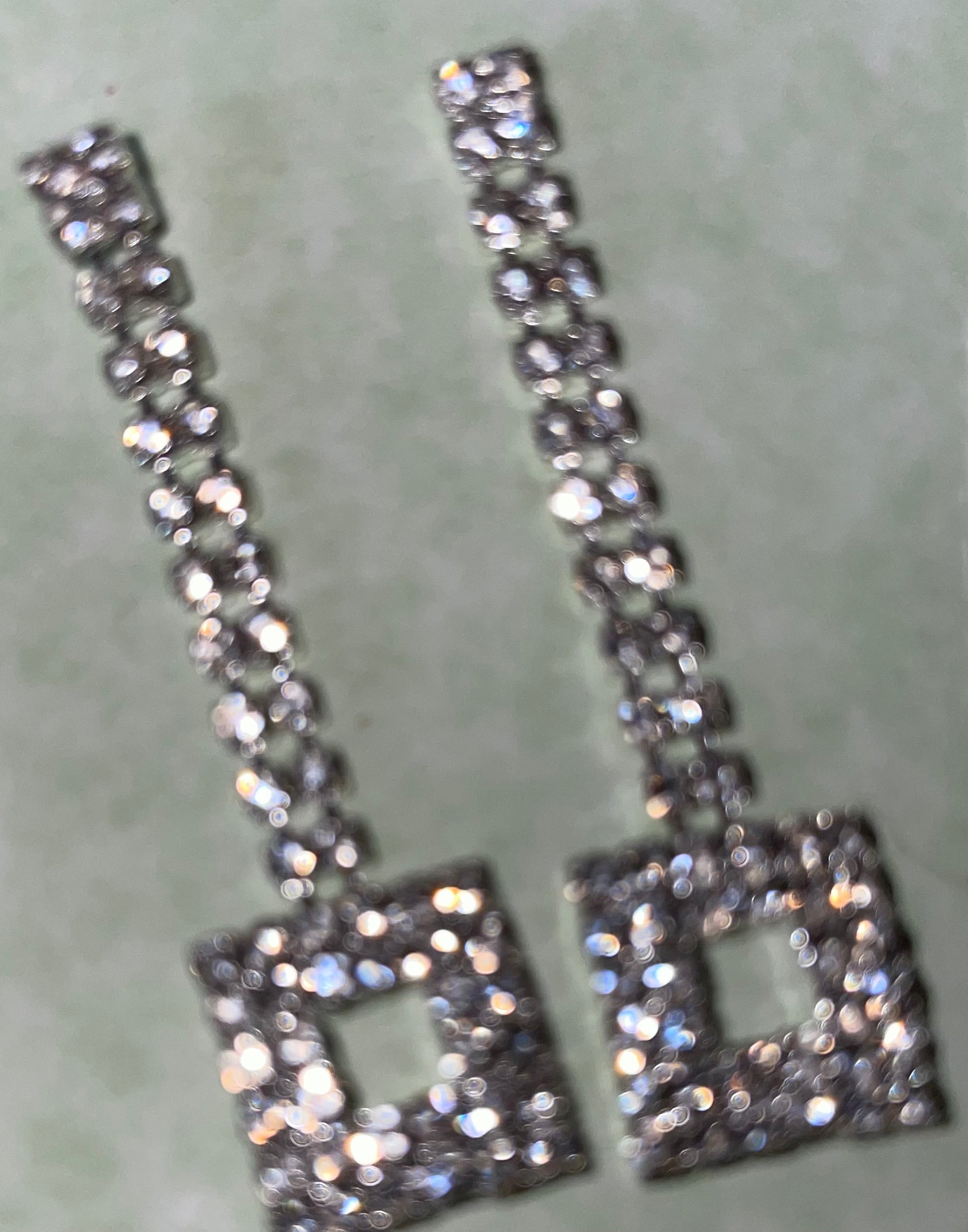 Dangling silver stone pierced earrings